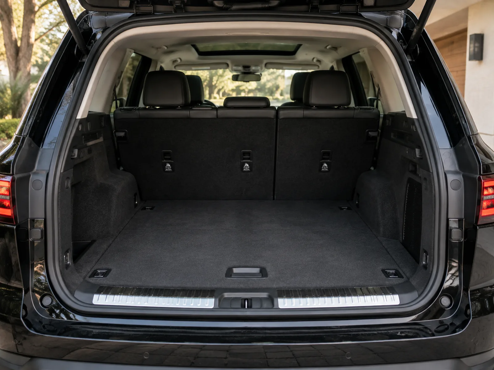 An SUV with the rear door open showing the interior space